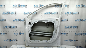 The bare front right door of a Hyundai Tucson 22-24 white TW3, dent, bump