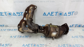 The exhaust manifold with a catalytic converter on a Nissan Rogue 14-19 has a broken bolt.
