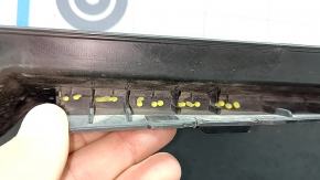 The bare lower rear bumper of a Hyundai Tucson 22-24 without parking sensors, structure, dented, cracked, scratched, broken fasteners