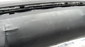 The bare lower rear bumper of a Hyundai Tucson 22-24 without parking sensors, structure, dented, cracked, scratched, broken fasteners
