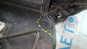 The front left fender liner of a Nissan Rogue 14-20 is broken and the sound insulation is torn.