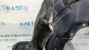 Front right fender liner of Nissan Rogue 14-20 is torn, sound insulation is torn