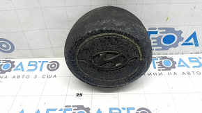 The steering wheel airbag for the driver's Hyundai Tucson 22-24 is black and melted.