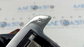 The left steering wheel paddle shifter on a Hyundai Tucson 2022-2024 has swollen chrome.