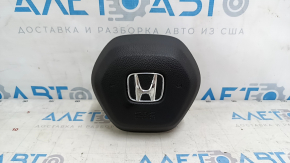 The Honda Accord 2023-2024 driver's steering wheel airbag is black and scratched.