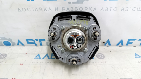 The Honda Accord 2023-2024 driver's steering wheel airbag is black and scratched.