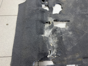 The floor covering under the 2nd row seats of the Chevrolet Equinox 18-24 is black and can be cleaned.