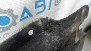 The left underbody protection of the BMW X3 G01 18-21 is dented and torn.