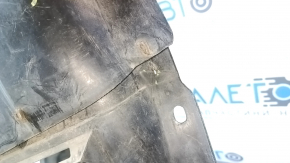 The front left fender liner of a Mazda6 03-05 is cracked and the fasteners have come loose.