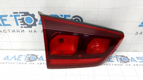 The inner tailgate light, left, Kia Niro 17-22, halogen, is worn, scratches, and the seal is peeling off.