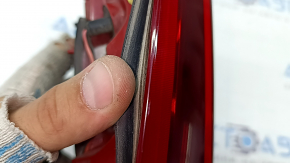 The inner tailgate light, left, Kia Niro 17-22, halogen, is worn, scratches, and the seal is peeling off.