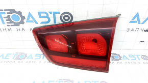 The right inner tailgate light for a Kia Niro 17-22 halogen is worn and the seal is peeling off.