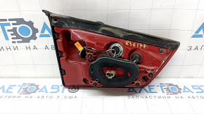 The right inner tailgate light for a Kia Niro 17-22 halogen is worn and the seal is peeling off.
