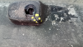 The left underbody protection of the Audi E-Tron 19-23 is torn and cracked.
