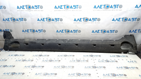 The left underbody protection of the Audi E-Tron 19-23 is torn and cracked.