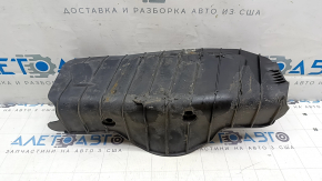The lower control arm cover under the rear left spring is worn out for the Audi E-Tron 19-23.