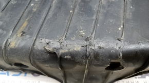 The lower control arm cover under the rear left spring is worn out for the Audi E-Tron 19-23.