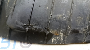 The lower control arm cover under the rear left spring is worn out for the Audi E-Tron 19-23.