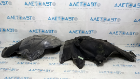 The rear left fender liner of the Chevrolet Equinox 18-24 is dented and torn.