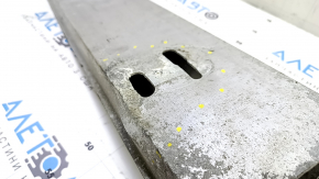 The rear bumper reinforcement for a Toyota Camry v50 12-14 USA is dented.