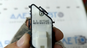 The front left central locking button for a Mercedes C-class W205 15-18 is black and has peeled off.