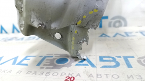 The left headlight lens of the Chevrolet Equinox 22-24 is dented and torn.