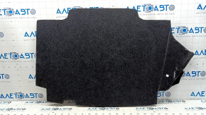 The trunk floor of a Toyota Camry v50 12-12 hybrid USA is gray, with creases and tears.