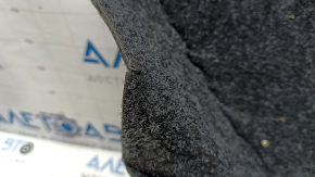 The trunk floor of a Toyota Camry v50 12-12 hybrid USA is gray, with creases and tears.