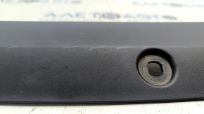 The front center hood trim for the Polestar 2 21-25 is worn.