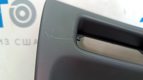 Polestar 2 21-25 black driver's knee pad, scratched