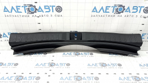 The trunk opening trim for a Toyota Rav4 19-24 is black, with scratches and whitened plastic.