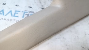 Upper trunk door trim for a Lexus RX300 98-03, beige, with brake light, scratches, nicks, scuffs, needs cleaning