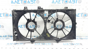 The diffuser radiator shroud is bare for a Toyota Camry V50 12-14 hybrid USA. The embedded parts are drilled out and the bolts are broken off.