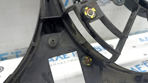 The diffuser radiator shroud is bare for a Toyota Camry V50 12-14 hybrid USA. The embedded parts are drilled out and the bolts are broken off.