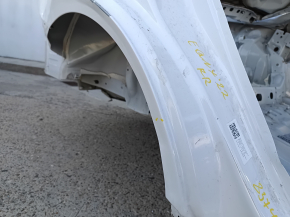 The rear right fender of a Chevrolet Equinox 18-24 is sunken on the body, white, dented