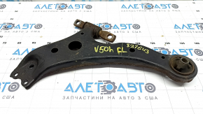 The lower front left control arm of a Toyota Camry V50 12-14 USA is rusty and has a cracked silent block.