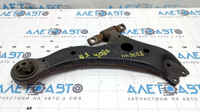 The lower front right control arm of a Toyota Camry V50 12-14 USA is rusty and has a cracked silent block.