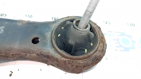 The lower front right control arm of a Toyota Camry V50 12-14 USA is rusty and has a cracked silent block.
