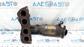 The exhaust manifold with a catalytic converter for a Toyota Camry V50 12-14 hybrid (USA) is rusty and has a broken stud.