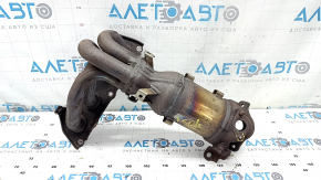 The exhaust manifold with a catalytic converter for a Toyota Camry V50 12-14 hybrid (USA) is rusty and has a broken stud.