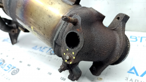 The exhaust manifold with a catalytic converter for a Toyota Camry V50 12-14 hybrid (USA) is rusty and has a broken stud.