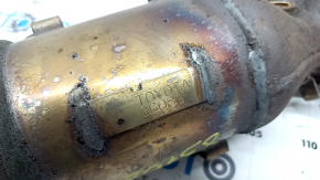 The exhaust manifold with a catalytic converter for a Toyota Camry V50 12-14 hybrid (USA) is rusty and has a broken stud.