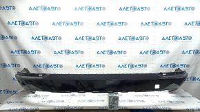The bare lower rear bumper of a Volvo XC90 16-23 for parking sensors, black, scratches, dented, broken mount