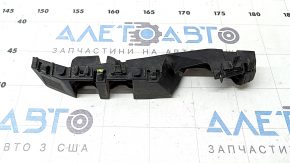 The front bumper mount on the right fender of a Kia Niro 23-24 is broken.