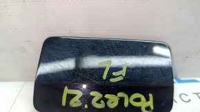 The front bumper headlight washer cap, left, Polestar 2 21-25, is worn out.