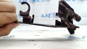 The front left brake hose bracket of the Audi E-Tron 19-23 is bent.