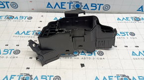The Lexus RX350 16-22 underhood fuse box housing has a broken mount.