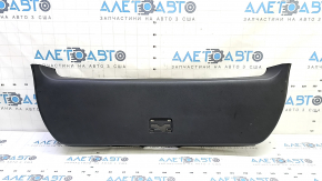The lower trim of the trunk door of a Toyota Prius 50 16-22 is black, worn, and the plug is missing.