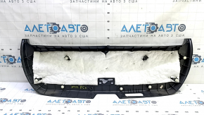 The lower trim of the trunk door of a Toyota Prius 50 16-22 is black, worn, and the plug is missing.