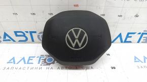 The driver's side airbag in the VW Tiguan 22-24 is black and has a rusty squib.